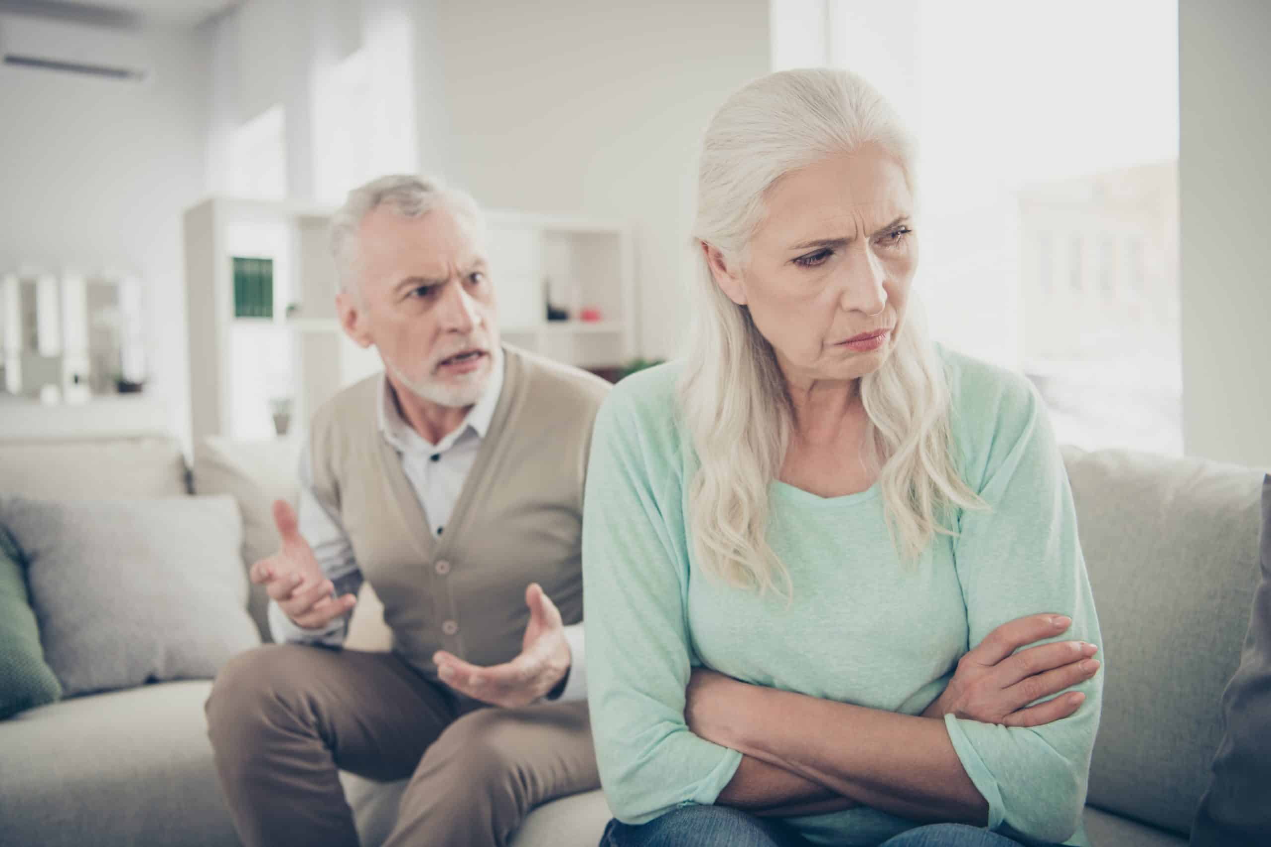Close-up photo of sad upset, long-haired old grandma do not want to listening to her strict husband who is sending claims