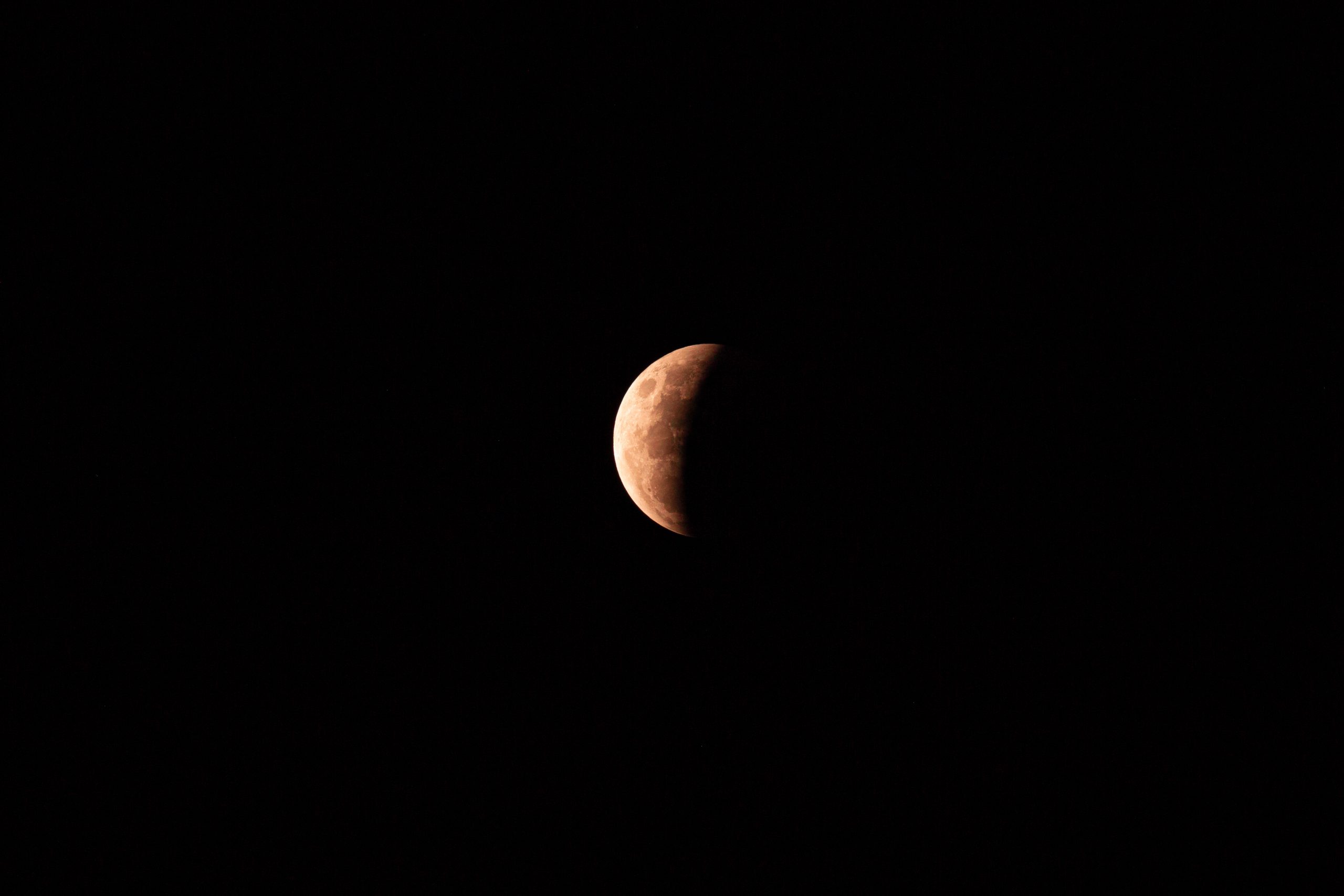 A view of the partial lunar eclipse in the dark sky