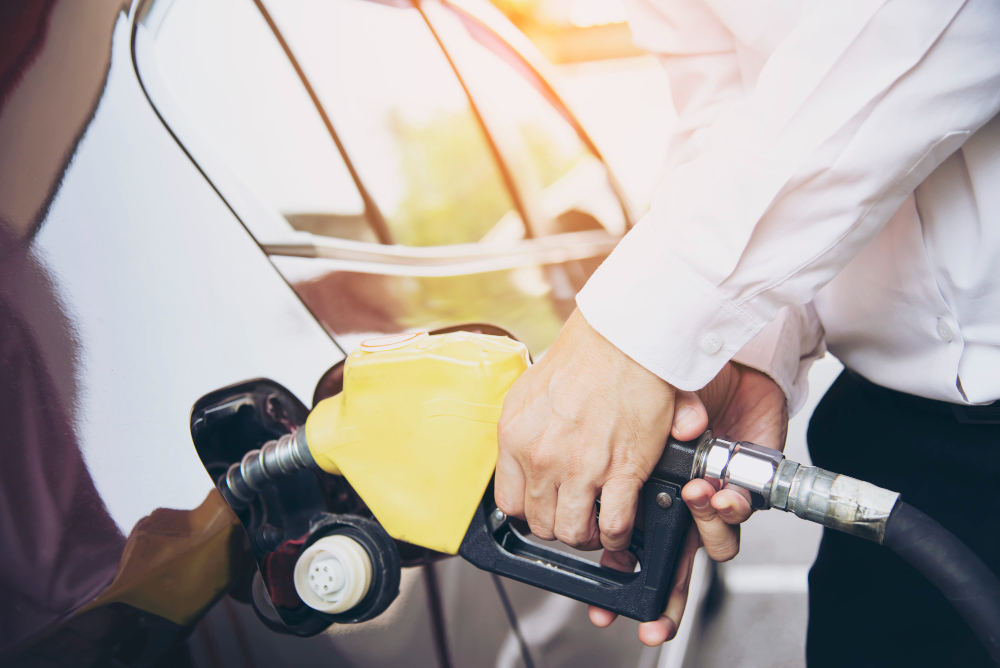 man-putting-gasoline-fuel-into-his-car-in-a-pump-gas-station