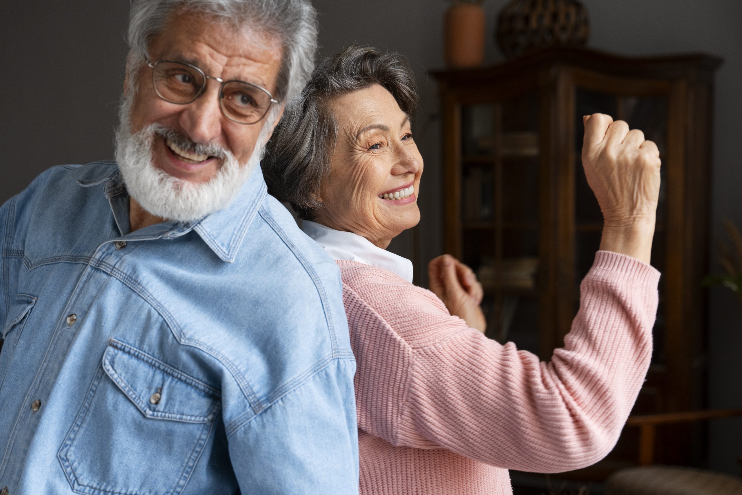 smiley-senior-couple-indoors-side-view