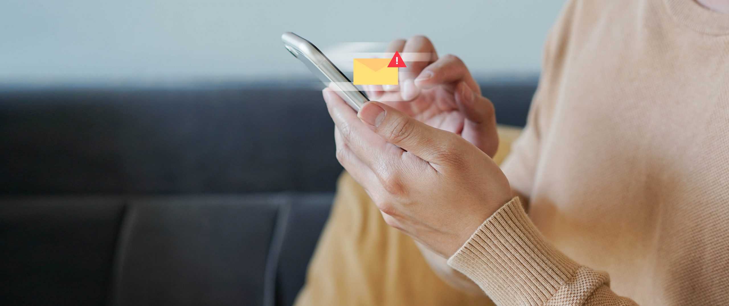 close up employee man hand holding smartphone to checking alert