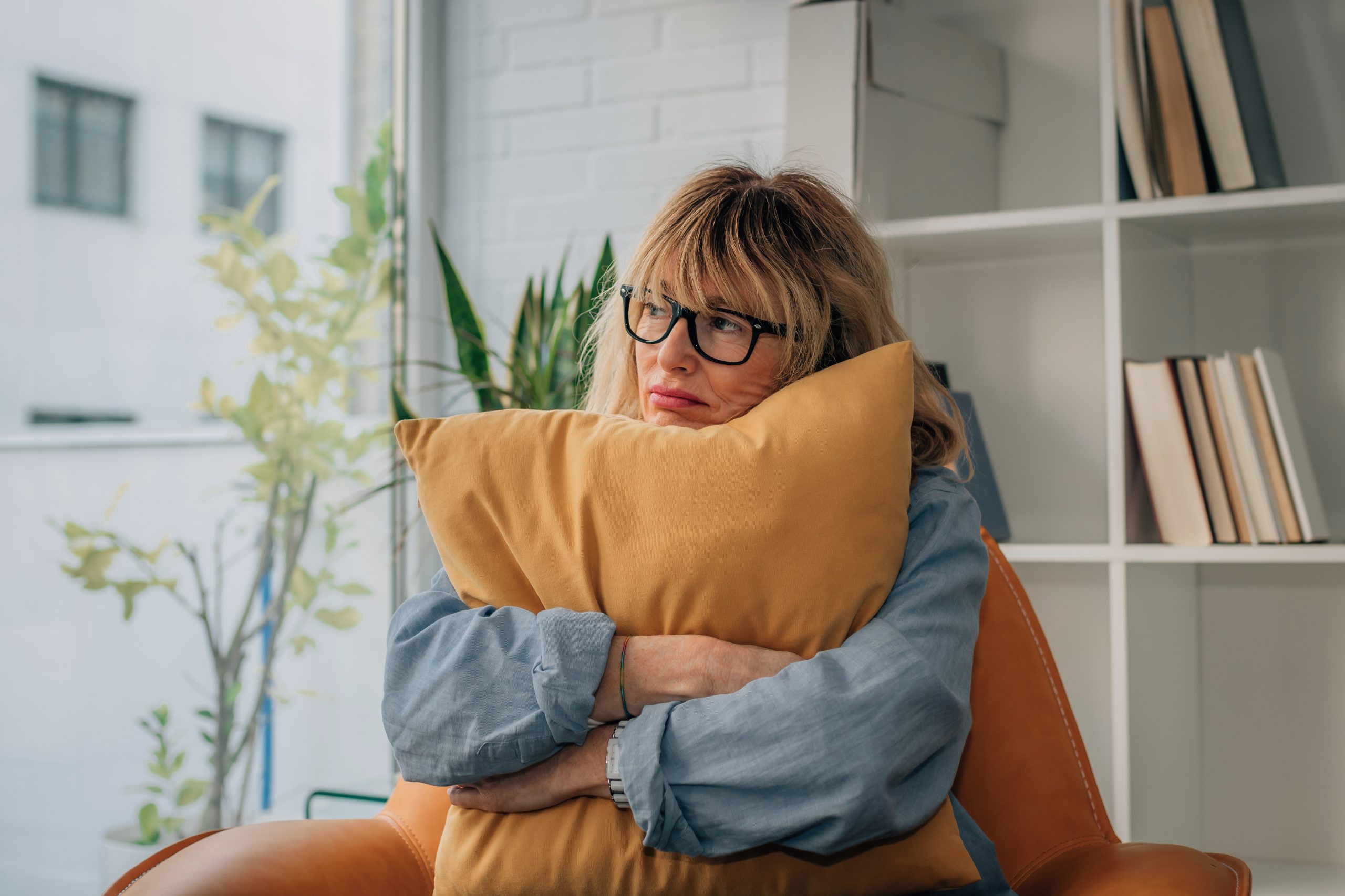 adult woman at home with expression loneliness or problems